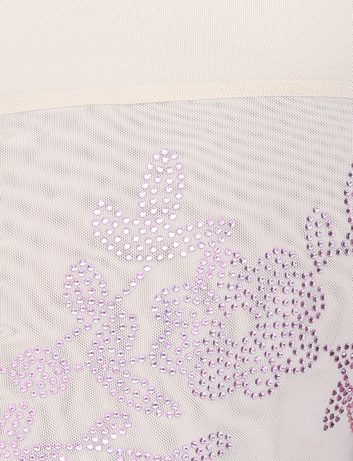 Close-up of the OCTAVIA TOP - NEUTRAL: CREAM by TIGERMIST, featuring sheer beige mesh fabric adorned with shiny purple sequin floral and leaf patterns.