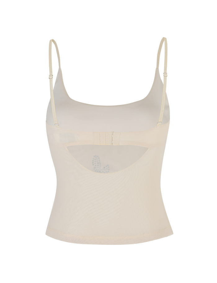 The OCTAVIA TOP - NEUTRAL : CREAM by TIGERMIST is a sheer, cream mesh camisole featuring thin adjustable straps and a curved front cutout.