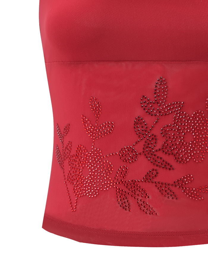 Close-up of the TIGERMIST OCTAVIA TOP - RED, a red spaghetti strap top with a sheer panel embellished with rhinestone floral designs. Delicate flowers and leaves sparkle against a plain white background.