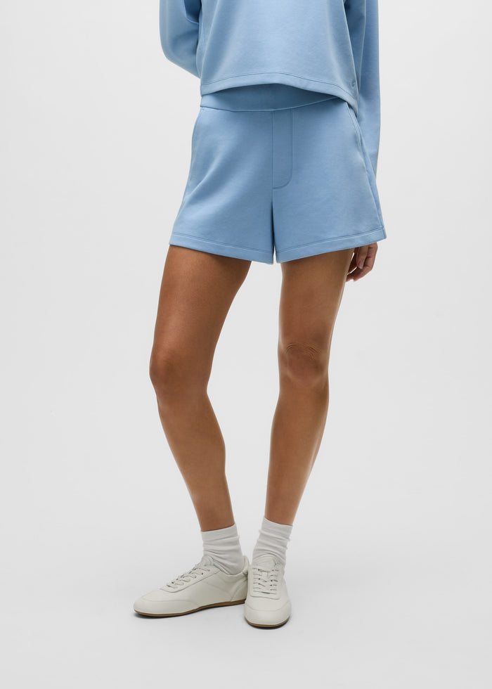 Wolf Blue Cotton Ojai Trouser Short - Front View On Model, Mid-Rise Tailored Fit with Welt Pocket | Greyson Clothiers