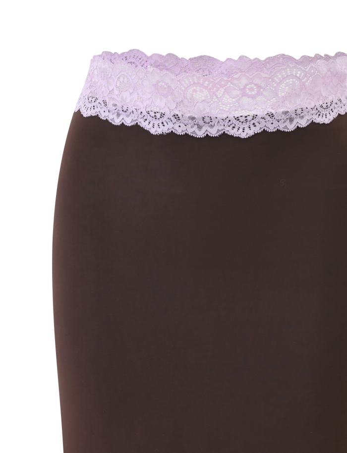 A close-up shows a torso wearing the TIGERMIST PARISA LACE TRIM MIDI SKIRT in brown and lilac, featuring a wide lilac floral lace waistband, set against a plain white background.