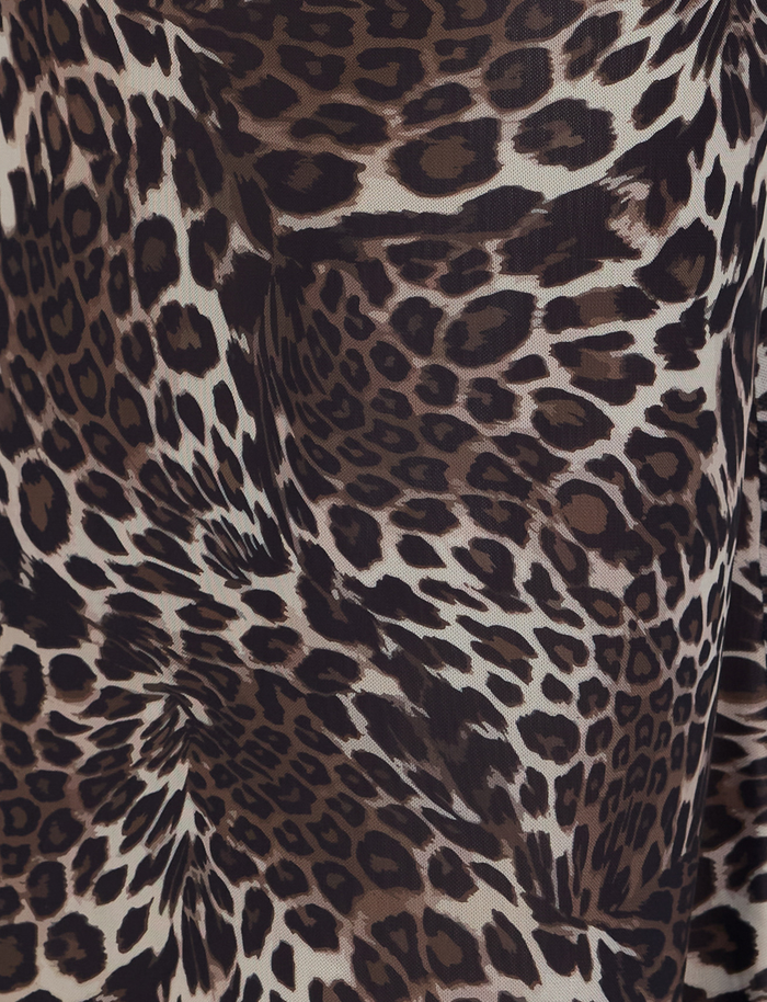 Close-up of TIGERMIST's PEARL MAXI SKIRT - MULTI : LEOPARD, showcasing a brown, black, and beige leopard print with varied spots and rosettes—ideal for statement maxi looks.