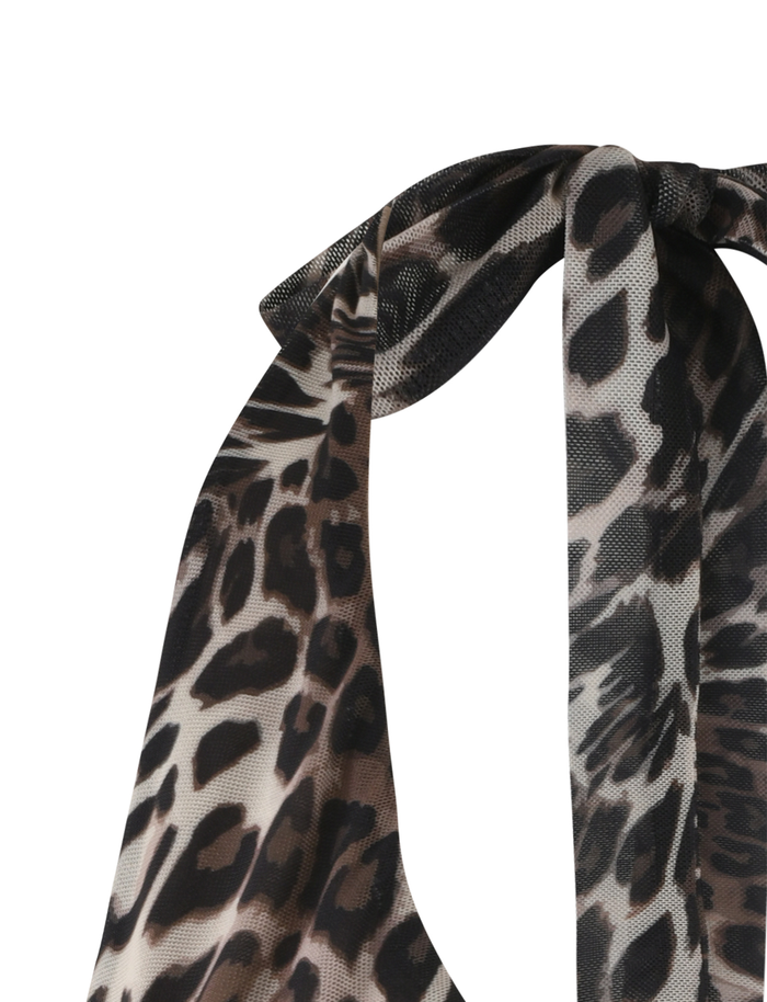 Close-up of the TIGERMIST PEARL TOP - MULTI : LEOPARD, featuring a tied bow and realistic brown, black, and beige leopard print spots. Displayed on a plain white background.