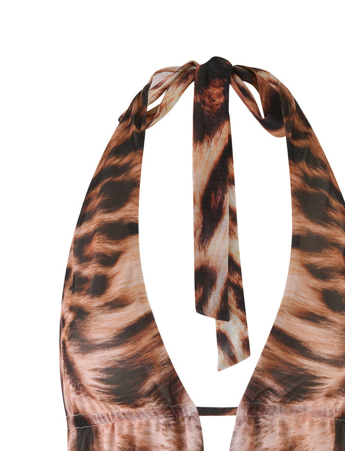 Close-up of the TIGERMIST PEARL TOP in Leopard Haze, featuring a plunging neckline and a bow at the neck. The fabric exhibits a realistic leopard colorway with an open back and deep V-cut design.
