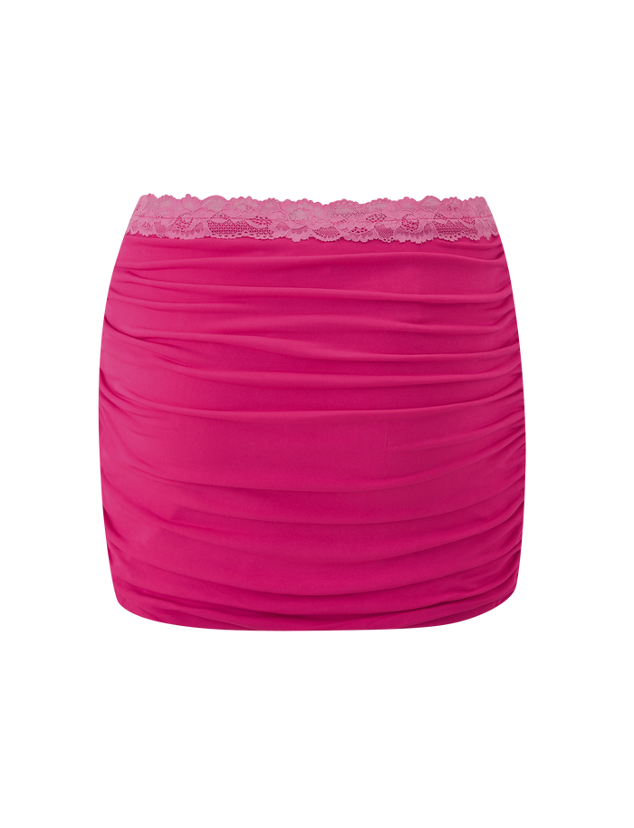 The TIGERMIST PERSI MINI SKIRT in magenta features a bodycon fit, ruching, and a scalloped lace waistband, shown on a plain white background.