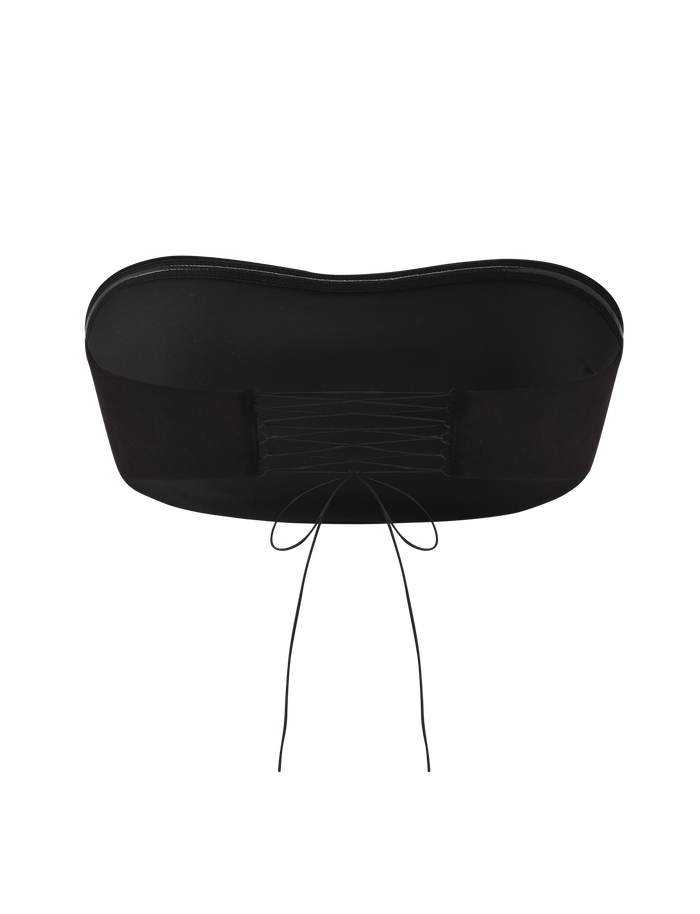 The TIGERMIST PILAR BANDEAU - BLACK is a cropped bandeau top with a straight neckline, lace-up back, and thin black strings tied in a bow, shown against a plain white background.