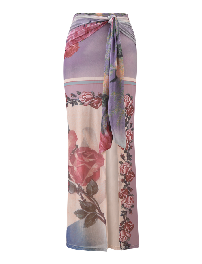 The RAFFIE MAXI SKIRT - POSTCARD FLORAL by TIGERMIST is a high-waisted, gathered waist tie skirt featuring a pastel purple, pink, and cream rose print and romantic flow, perfect for any occasion.