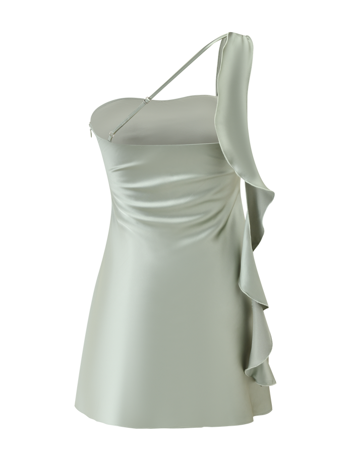 The RAINEY MINI DRESS - PISTACHIO by TIGERMIST is a pastel green satin mini dress featuring an asymmetrical neckline, one thin shoulder strap, and a striking waterfall ruffle down one side.