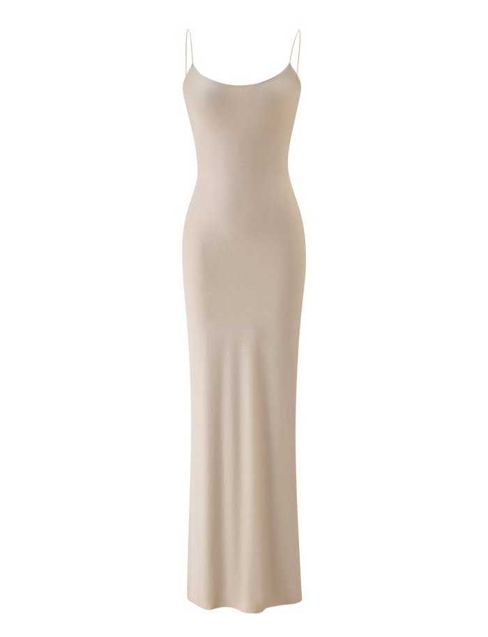The TIGERMIST RILEY MAXI DRESS - CHAMPAGNE SPARKLE features a fitted bodice, thin spaghetti straps, and a body-hugging silhouette in champagne gold, shown on a plain white background.