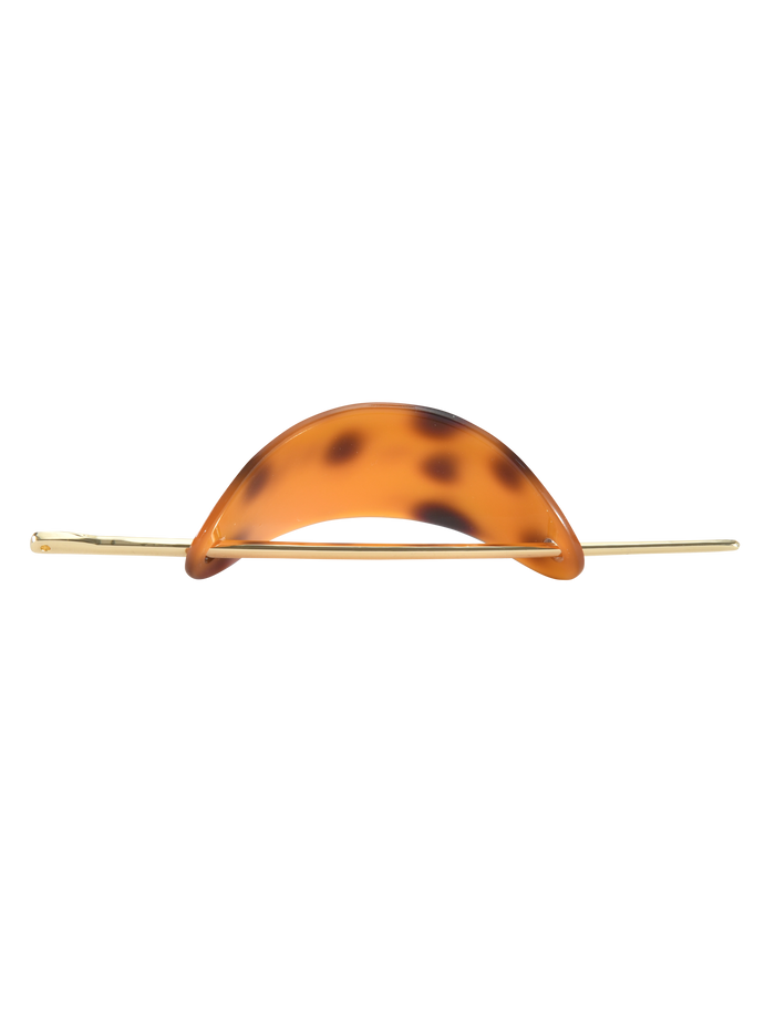 The RUKA BARETTE - TORTOISESHELL by TIGERMIST is a chic gold hair accessory with a curved acrylic tortoiseshell barrette accent, displayed on a plain white background.