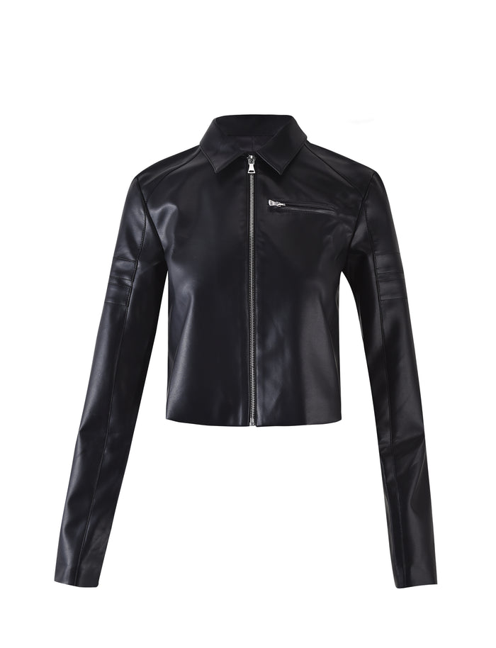Introducing the RYDER JACKET - BLACK from TIGERMIST, a black faux leather cropped jacket featuring a front zipper closure, classic collar, and long sleeves. The design includes a small chest pocket with a zipper on the left side and stitched seam details on the sleeves.