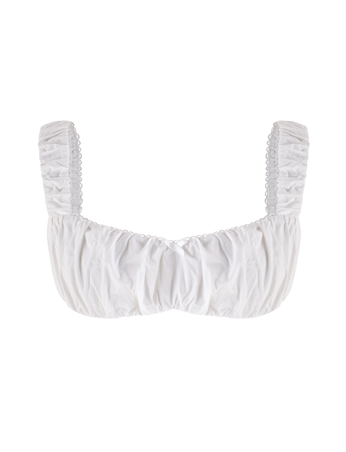 The SABRA TOP - WHITE by TIGERMIST is a white, ruched crop top featuring wide gathered straps and a sweetheart neckline, shown against a plain white background.