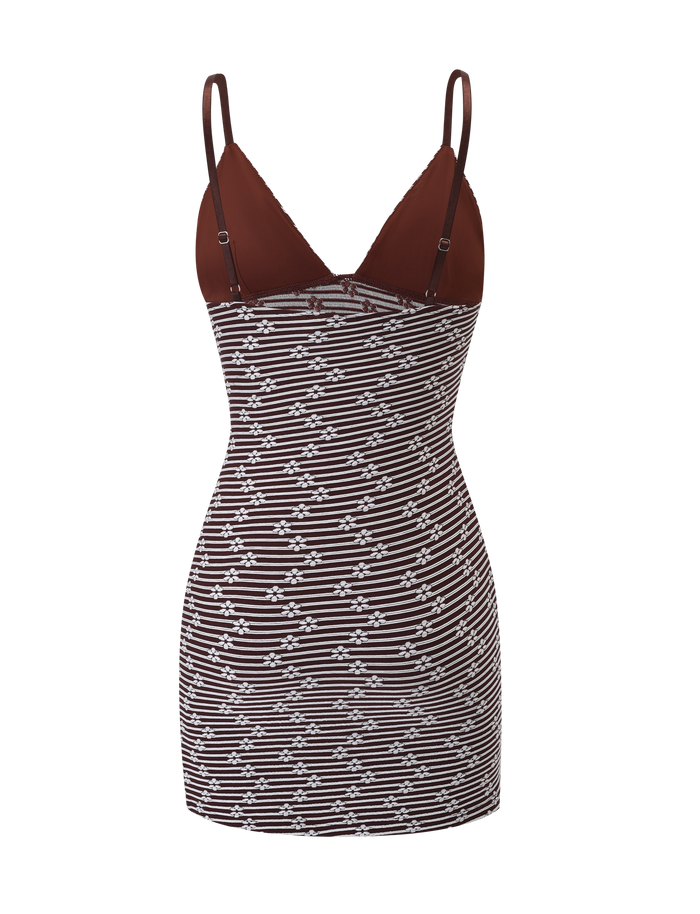 The SAHRA MINI DRESS by TIGERMIST is a sleeveless, body-con piece featuring a deep V-neckline, thin straps, a solid chocolate brown top, and a skirt with chocolate brown and white diagonal stripes.