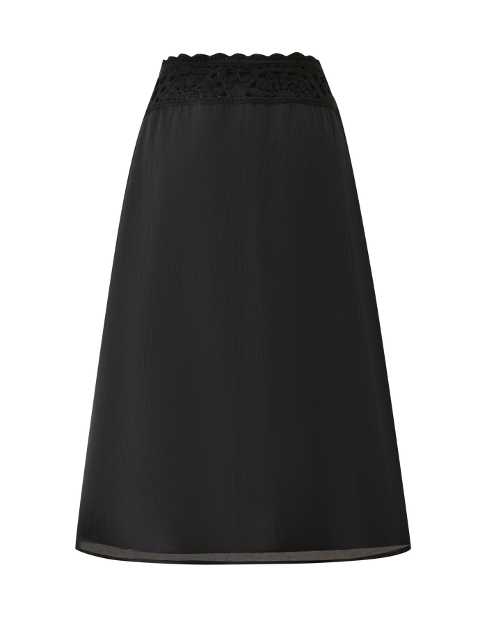 The TIGERMIST SASHA CROCHET MIDI SKIRT in black is an A-line, high-waisted cotton poplin skirt featuring a scalloped lace-trimmed waistband, shown against a white background.