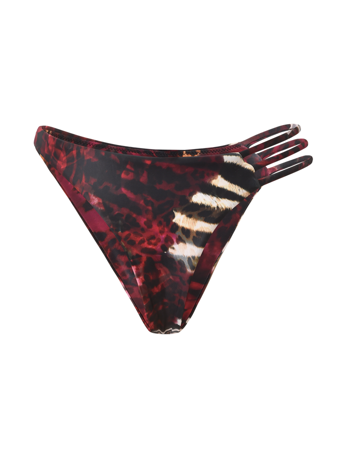 The SHARLI BIKINI BOTTOM by TIGERMIST features a mixed animal print in red and black with three thin side straps on one side, showcased against a plain white background.