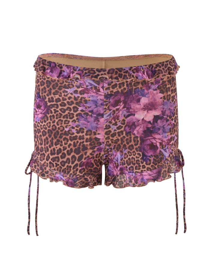 The SIERA SHORT - LEOPARD FLORAL by TIGERMIST are women's bodycon shorts with a leopard print, purple floral accents, ruffled hems, and side drawstrings.