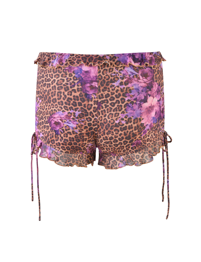 The TIGERMIST SIERA SHORT - LEOPARD FLORAL is a high-waisted pair of shorts featuring leopard print with purple and pink florals, ruffled hems, a bodycon fit, and adjustable side drawstrings, shown on a white background.