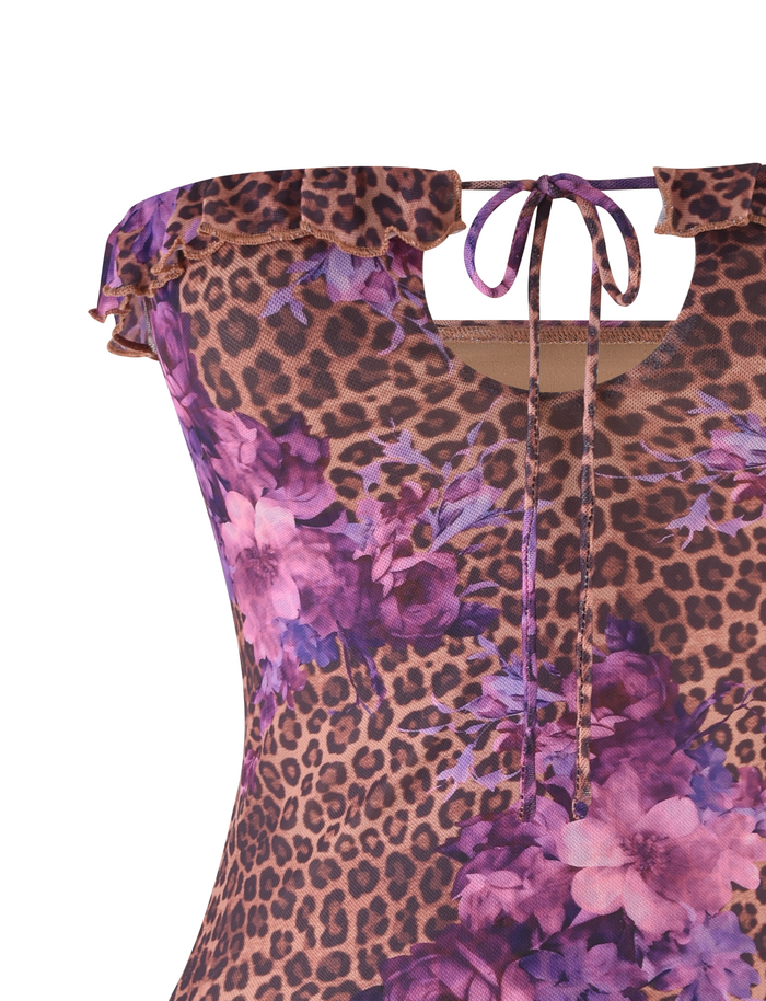 A close-up of the TIGERMIST SIERA TOP - LEOPARD FLORAL, a sleeveless piece with a brown leopard and purple floral print, ruffled neckline, and front tie detail.