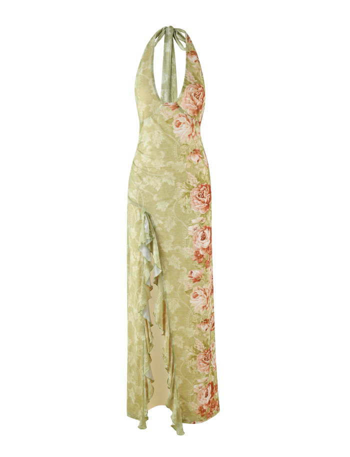 The SIRENA MAXI DRESS by TIGERMIST features a sleeveless floral design with rose stripes in yellow, a halter neck, deep neckline, ruffled details, and a high split for added allure.