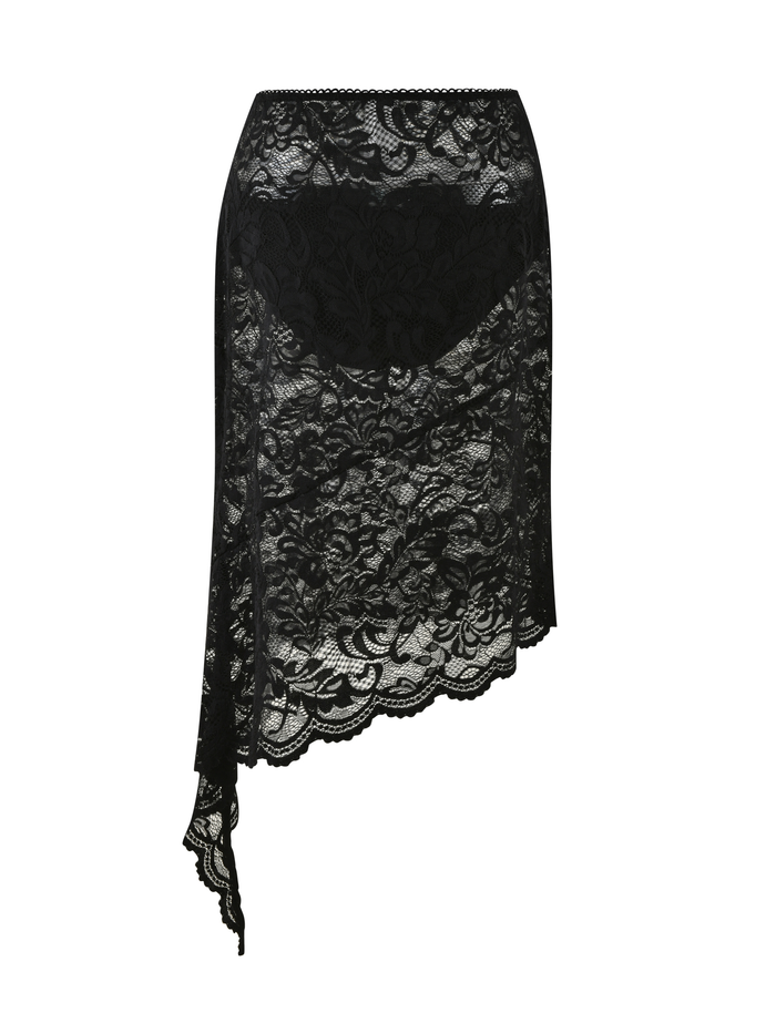 The TIGERMIST SIYA MIDI SKIRT features black lace, an asymmetrical hemline with a longer draped side, floral patterns, and a see-through design.