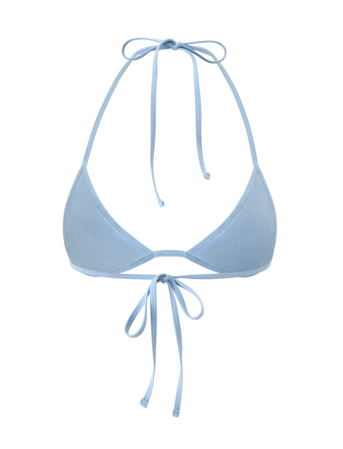 The SOLAS SEQUIN BIKINI TOP - SKY BLUE by TIGERMIST features thin straps that tie at the neck and back, offering subtle shimmer—perfect for beach club swimwear. Shown against a white background.