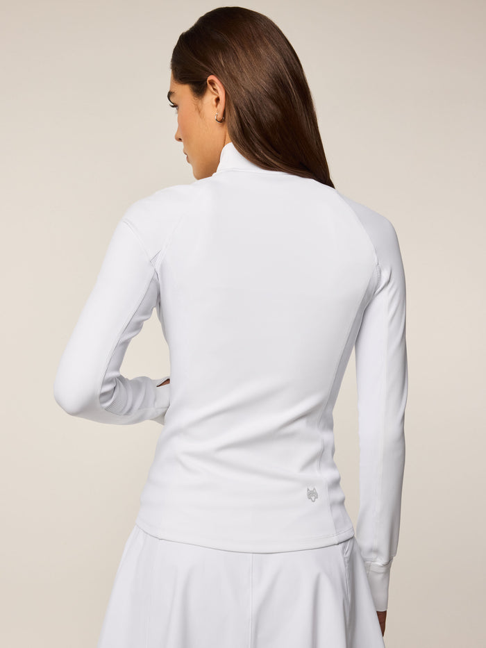 Greyson Clothiers Soleil Full-Zip Jacket Arctic White - Back View, Wolf Logo at Hem, Women's Golf Layer
