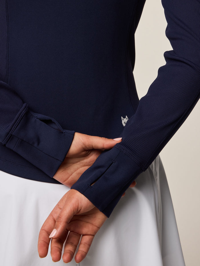 Greyson Clothiers Soleil Full-Zip Jacket Maltese Blue - Cuff & Wolf Logo Close-Up Detail, Thumbhole Sleeve