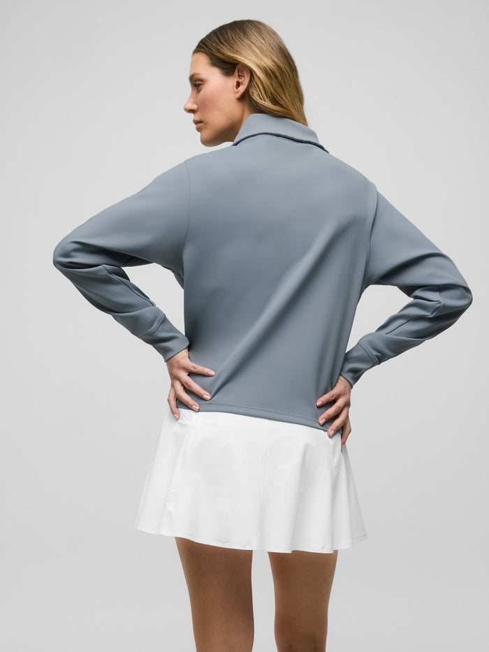 Bluestone Soleil Half Zip Pullover - Back View Styled with White Golf Skirt | Greyson Clothiers