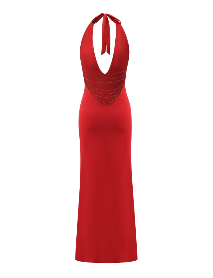 The SOLYNE MAXI DRESS by TIGERMIST is a sleeveless, floor-length deep red dress featuring a halter neckline, open back, and thin horizontal glittery straps across the lower back.