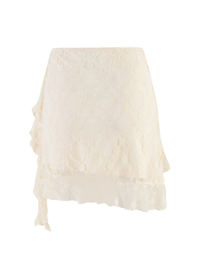 The STORMI LACE SKIRT by TIGERMIST in Champagne Beige features asymmetrical ruffle details along the hemline. The delicate lace pattern adds a touch of elegance, making it suitable for both casual and formal occasions. The skirt has a fitted waist and a slightly flared silhouette.