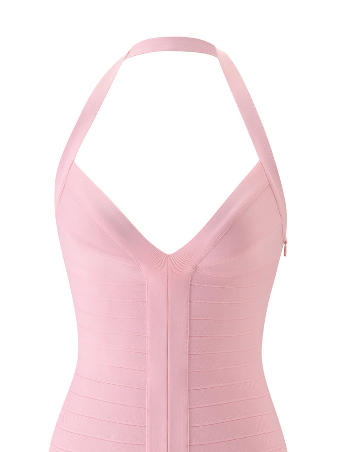 A close-up of the TIGERMIST SYDEL BANDAGE MINI DRESS in Pink Peony, featuring a sleeveless design, halter neckline, and a deep V-shaped front.