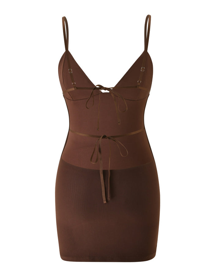 Introducing the SYLA MINI DRESS - CHOCOLATE by TIGERMIST: This chic chocolate-hued bodycon mini dress features a sleeveless silhouette with slim shoulder straps, a plunging V-neckline, and decorative tie accents at the bust and waist. An alluring open back lends added sophistication to this standout wardrobe staple.