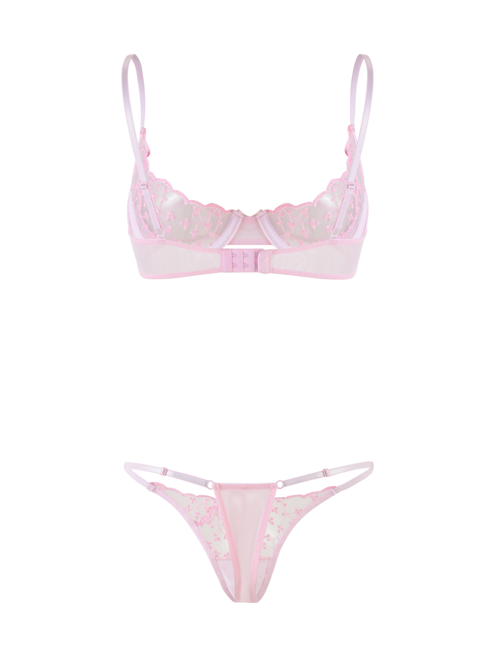 The TALIYAH SET - PINK : BABY PINK by TIGERMIST includes a sheer lace bra and matching g-string with floral embroidery and delicate straps, shown against a white background.