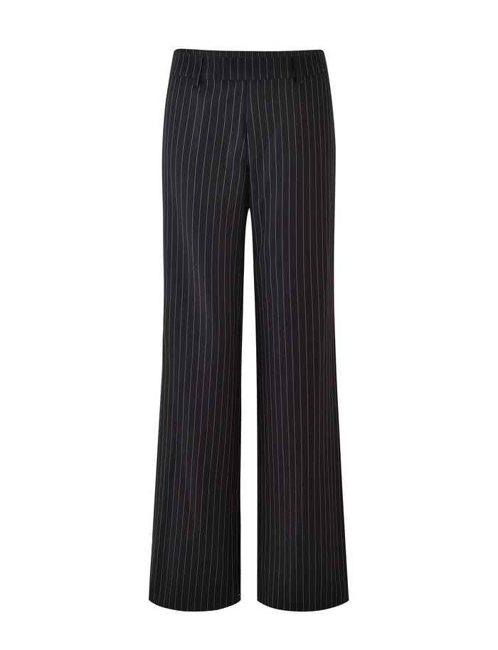 TIGERMIST's TAMARA PANT - BLACK : PINSTRIPE features a straight-leg silhouette with vertical white stripes, showcasing a sleek design without visible pockets. The smooth, mid-rise waistband lacks belt loops or fasteners, and the fabric’s subtle sheen enhances its suitability for formal business attire.