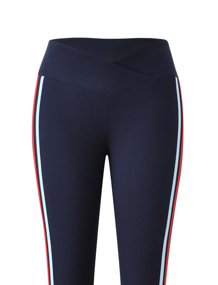 The TIGERMIST TATUM CAPRI - NAVY STRIPE features a V-front waistband and vertical red and light blue side stripes for a sporty, flattering look.