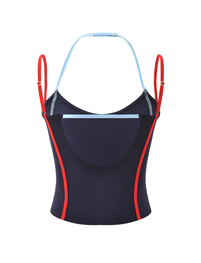 The TIGERMIST TATUM TOP - NAVY STRIPE features red straps and side piping, light blue neckline trim, an open back, and a built-in shelf bra, shown on a plain white background.