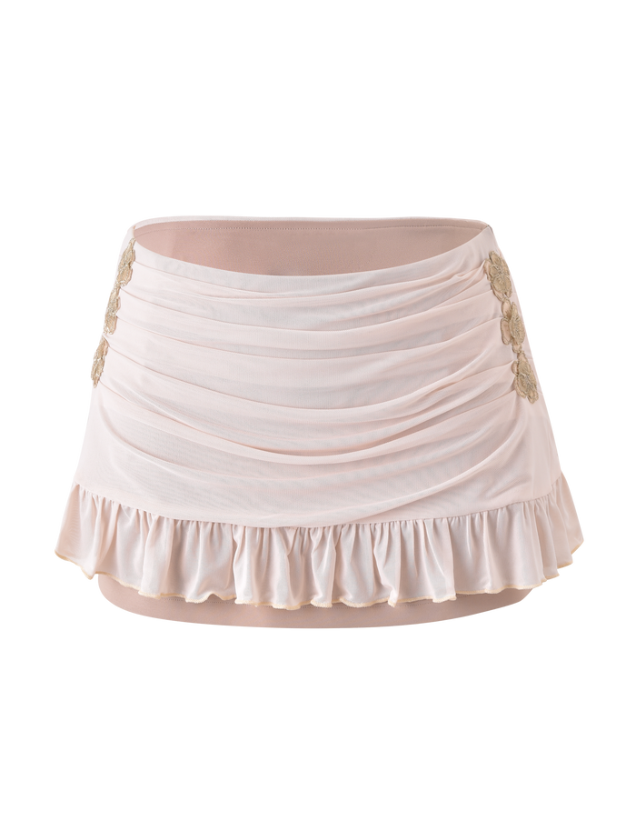 The TIGERMIST TERESE FLORAL APPLIQUE SKIRT in tan is a ruched mini skirt with a ruffled hem and gold floral appliques on the sides, shown against a plain white background.