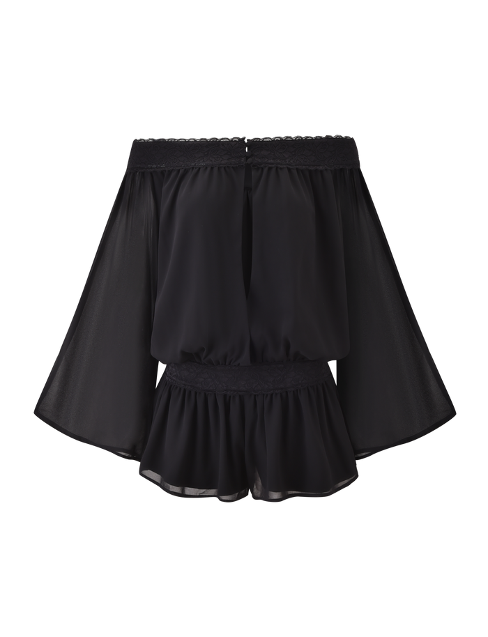 The TESSIE PLAYSUIT in black by TIGERMIST features an off-the-shoulder design with lace trim, sheer wide sleeves, a gathered waist, and a slightly flared hem. Shown against a plain white background.