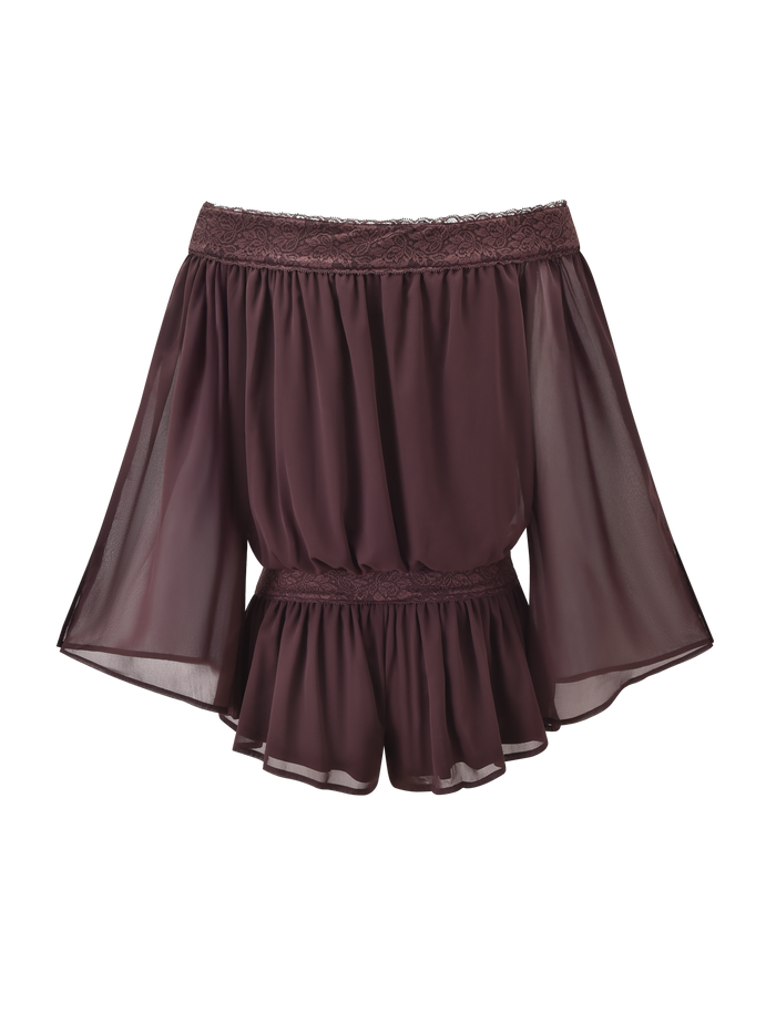 The TIGERMIST TESSIE PLAYSUIT in brown features a flowy, off-the-shoulder design with sheer fabric, wide sleeves, and lace trim at the neckline and waist, styled with ruffled mini shorts on a plain white background.