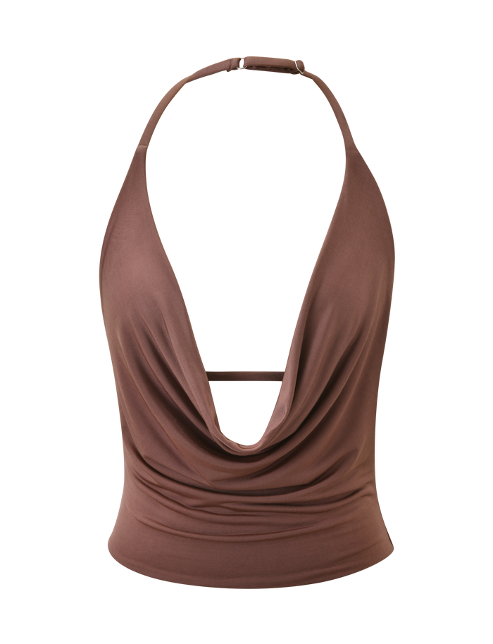The THARA TOP - CHOCOLATE by TIGERMIST is a sleeveless, chocolate halter top with a plunging cowl neck, open back, thin adjustable neck strap, and fitted silhouette. Made from silky soft fabric for a chic, flattering look.