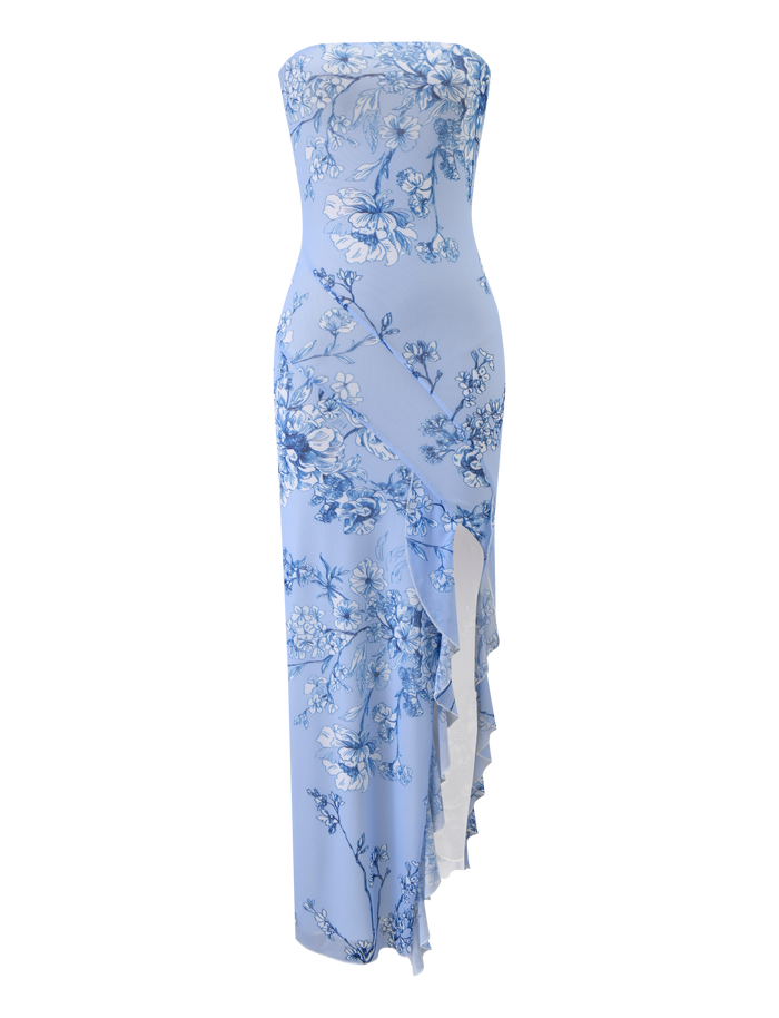 The TIGERMIST THEO MAXI DRESS - BLUE FLORAL is a strapless, light blue mesh bandeau maxi dress with a fitted silhouette, blue floral print, and asymmetrical ruffled detailing on the skirt.