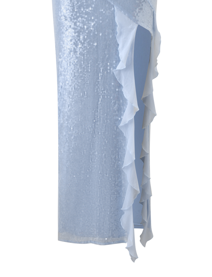 Close-up of the TIGERMIST THEO SEQUIN MAXI DRESS in soft blue, featuring shimmering sequins and ruffled sheer trim cascading down the side for an elegant, textured touch.