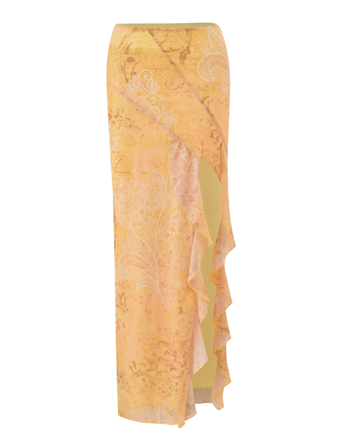 The THEO SKIRT - LEMON BUTTERFLY PAISLEY by TIGERMIST is a long, high-waisted yellow wrap skirt with a white floral paisley print, front leg slit, and ruffled trim, shown on a plain white background.