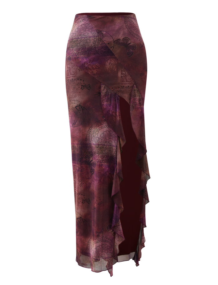 The TIGERMIST THEO SKIRT in Plum Butterfly Paisley is a long, high-waisted semi-sheer skirt with an abstract print and an asymmetrical waterfall ruffle slit on the front right. It features a fitted shape and slightly flared hem.