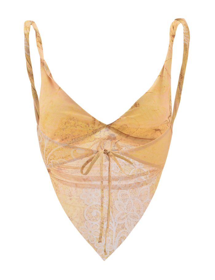The THEO TOP - LEMON BUTTERFLY PAISLEY by TIGERMIST is a yellow and beige camisole with butterfly paisley print, thin straps, a pointed handkerchief hem, and a front center tie detail.