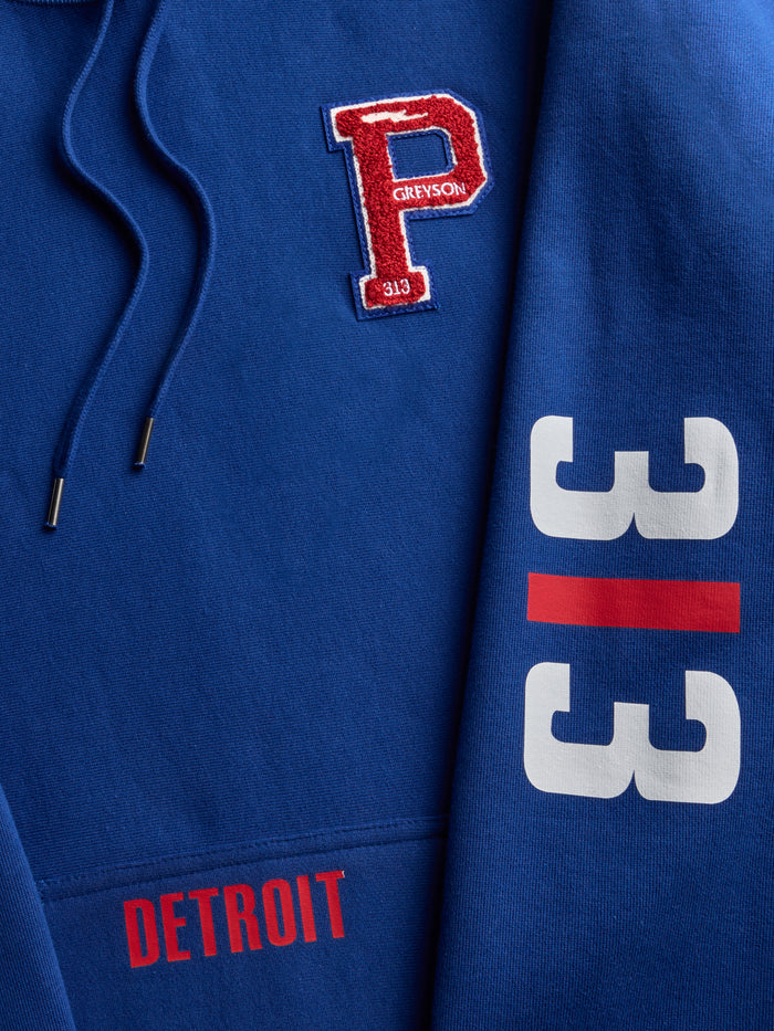 Detroit 313 Fireside Hoodie Close-Up - Chenille P Patch, Detroit Pocket Text & 313 Sleeve Detail | Greyson Clothiers