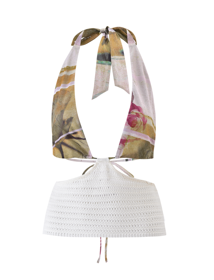 The TILLEY TOP - ROSE POSTCARD by TIGERMIST is a stylish crochet top with a floral mesh, satin-like upper, white crocheted lower section with pointed hem, neck ties, and an open back.