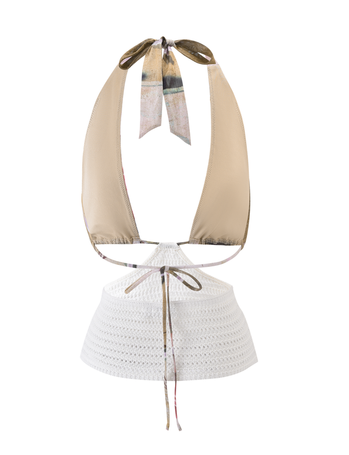 The TILLEY TOP - ROSE POSTCARD by TIGERMIST is a beige halter bikini with an exclusive print and patterned neck ties, styled with a white lacy skirted bottom featuring a waist tie and chic crochet texture.