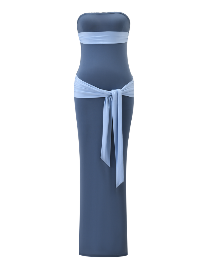 The TIGERMIST TOVE Maxi Dress in blue is strapless with a fitted silhouette, featuring a light blue band at the top and a matching sash at the waist.