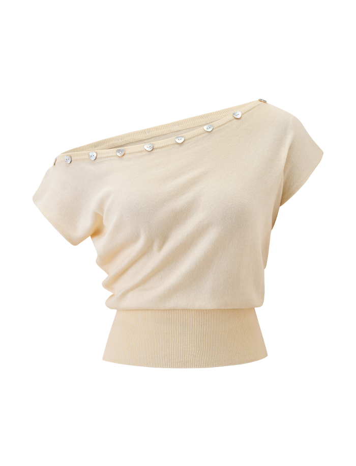 The TYLA SLEEVELESS KNIT TOP by TIGERMIST in cream features an off-shoulder design, ribbed waistband, and heart button accents along the neckline.